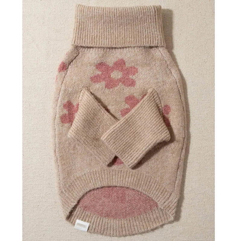 Underside of the floral dog sweater showing sleeves and belly opening
