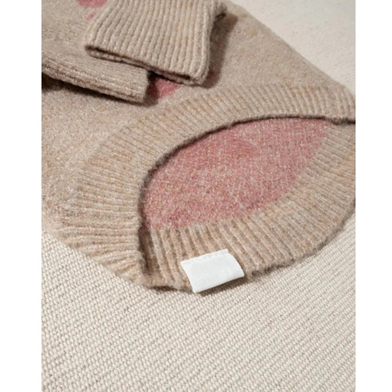 Ribbed sleeve cuffs and hem of the taupe floral dog sweater