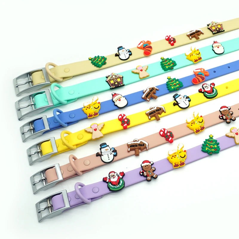 Christmas dog collar charms, including Santa, snowman, reindeer, gingerbread man and Christmas tree, on six pastel dog collars
