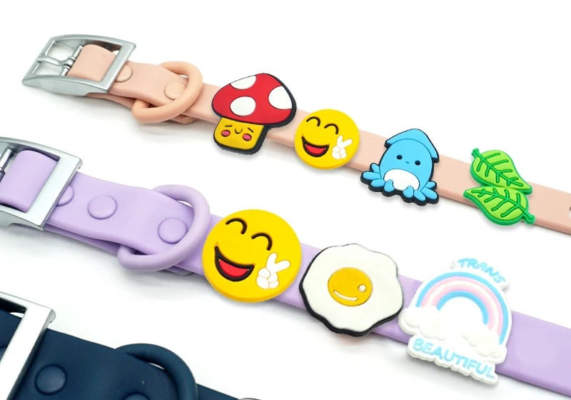 Pastel PVC dog collar charms including mushroom, smiley face, whale, leaf, fried egg and rainbow designs